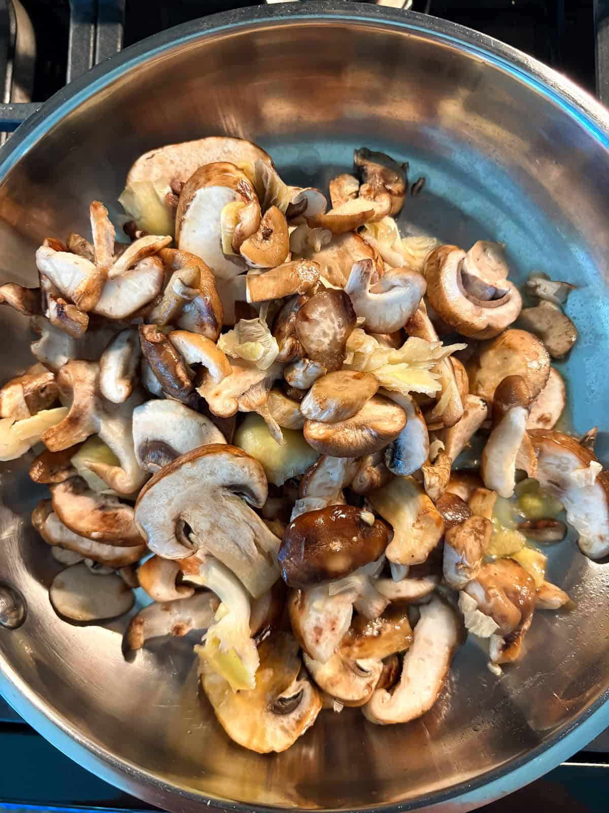 Mushrooms in a saute pan.