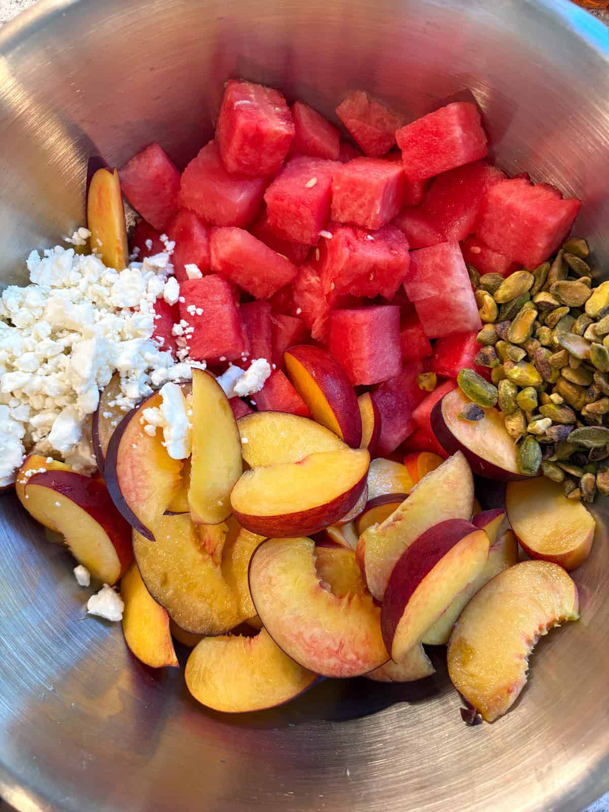 Feta cheese and pistachios added to the fruit.