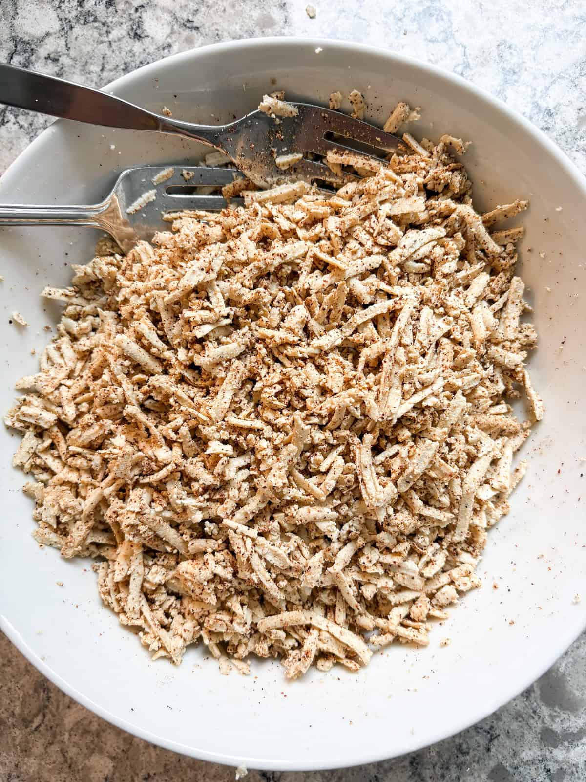 Tofu tossed with spices.
