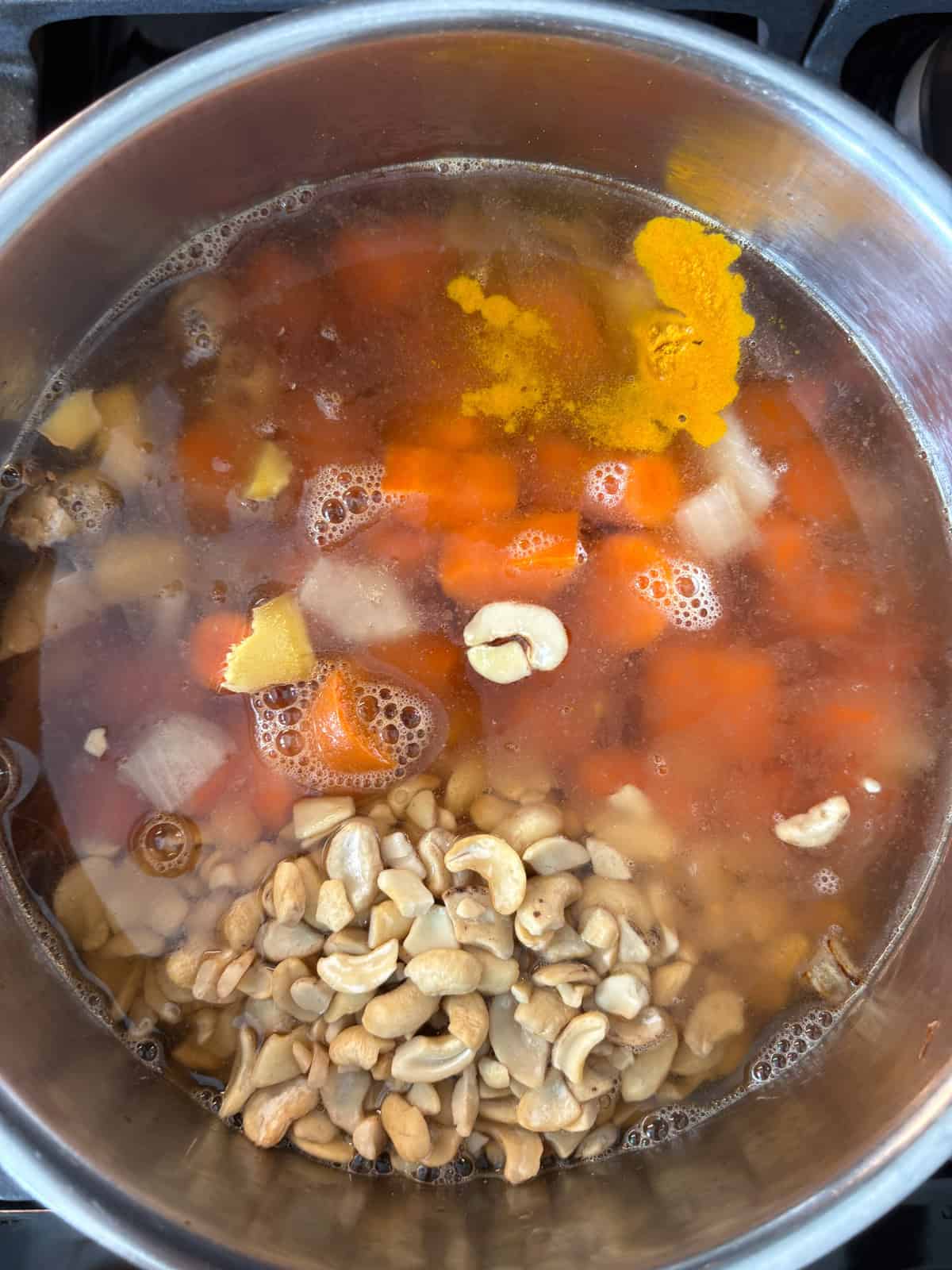 Soup ingredients in a pot to simmer.