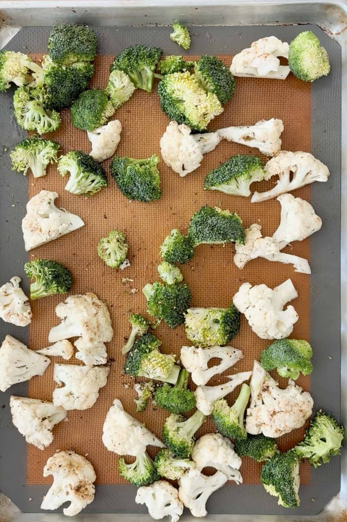 Chopped broccoli and cauliflower tossed with oil and spice.