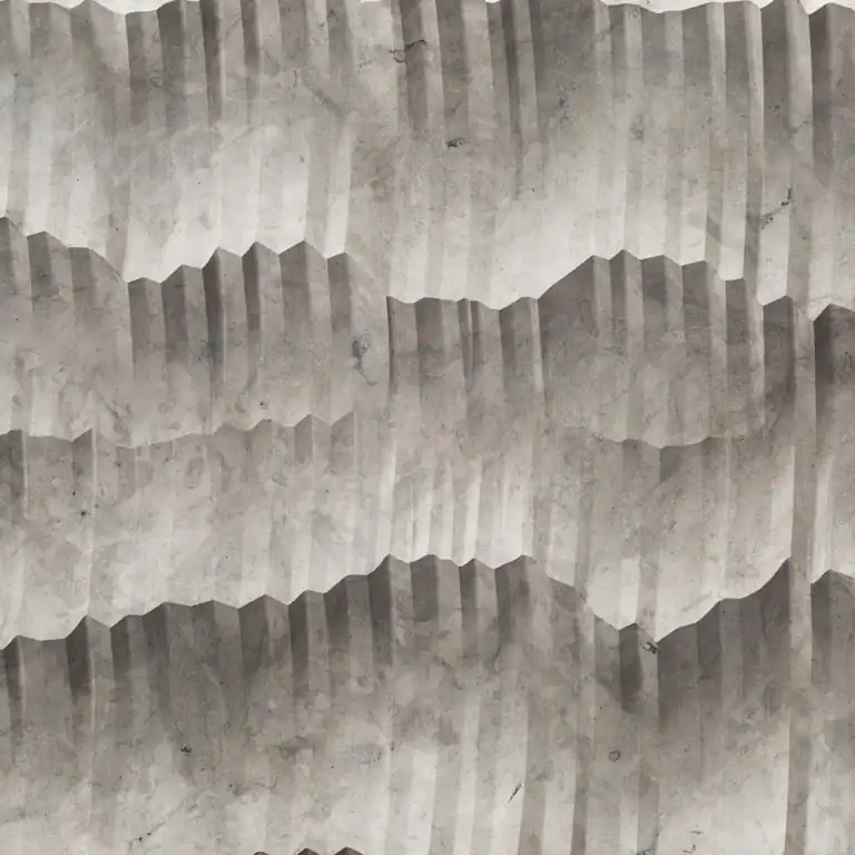 Textured concrete wall with geometric patterns in gray tones.