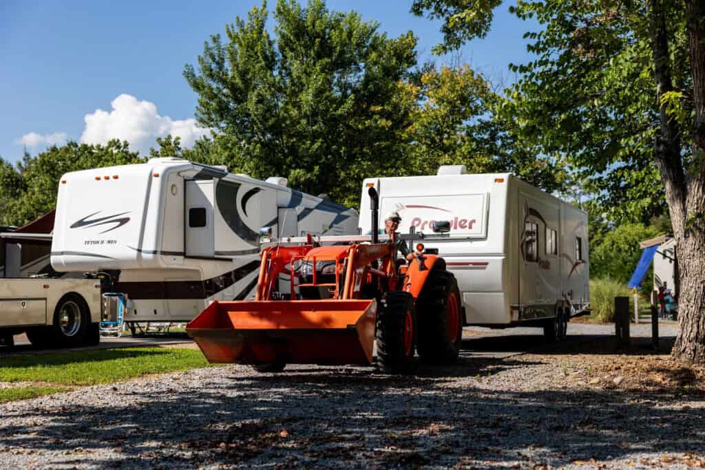 A tractor parked next to a RV at the Big Meadows Campground.