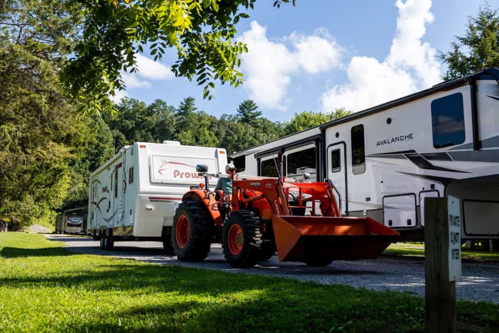 An RV parked at Big Meadows Campground next to a tractor.