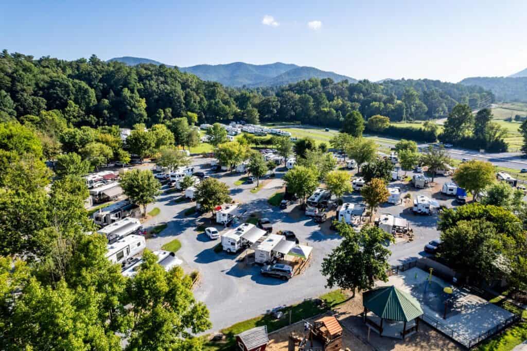 An aerial view of an rv park in the mountains.