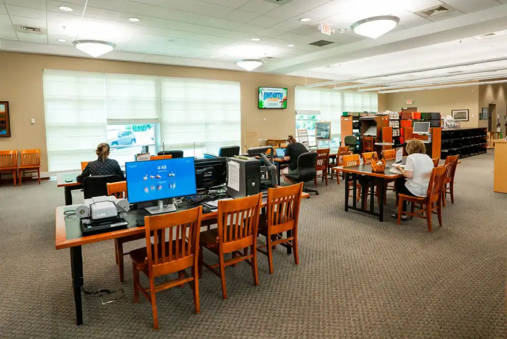 SHot of the library with patrons enjoying the facility.