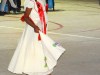 A young solo performer shyly enchants the crowd with her dance..