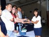 Proud graduate receives her certification from officials.