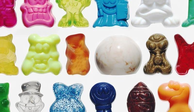 Karolina Burlikowska captures cherries in brandy glasses, rain-soaked flowers, vivid contrast