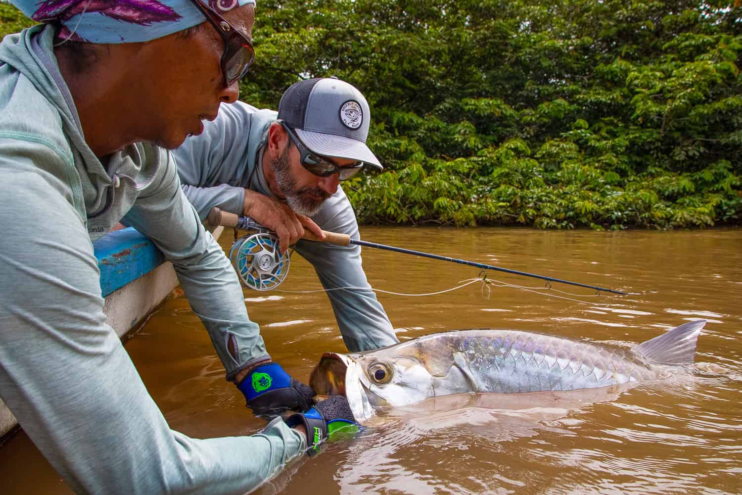 holding a tarpon in costa rica