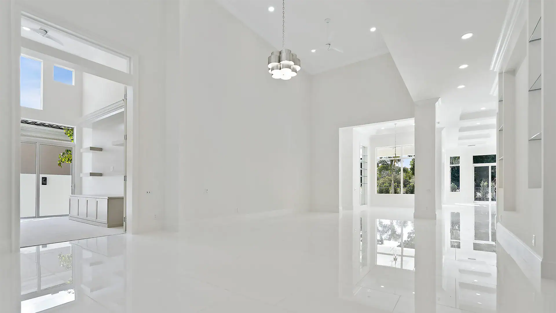 Refined white passageway showcasing a magnificent glass door.