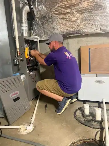 Home-Heroes-Plumbing-Heating-And-Air-Technician-Servicing-Lennox-Furnace