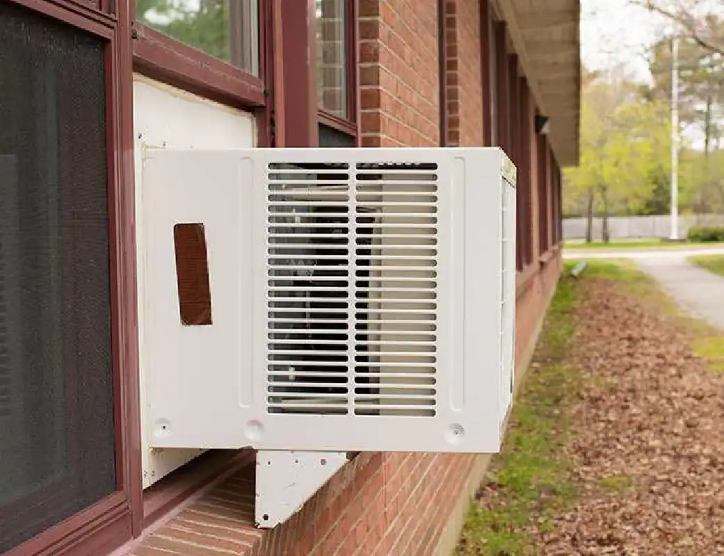 Window-Air-Conditioning-Unit-Installed-On-Brick-Building