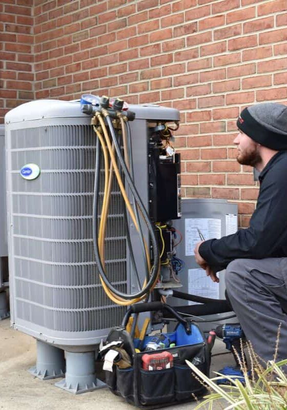 HVAC-Technician-Repairing-Outdoor-Air-Conditioning-Unit