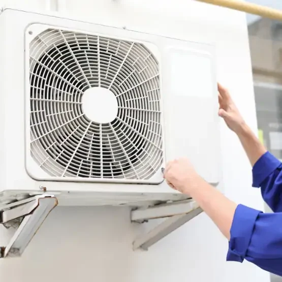 Technician-Inspecting-Outdoor-Air-Conditioning-Unit