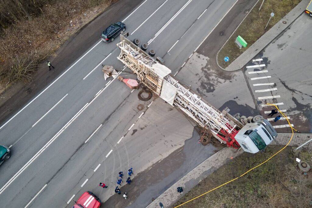 Accident involving a large truck and a fallen utility pole on a busy Arizona road. Emergency respond.