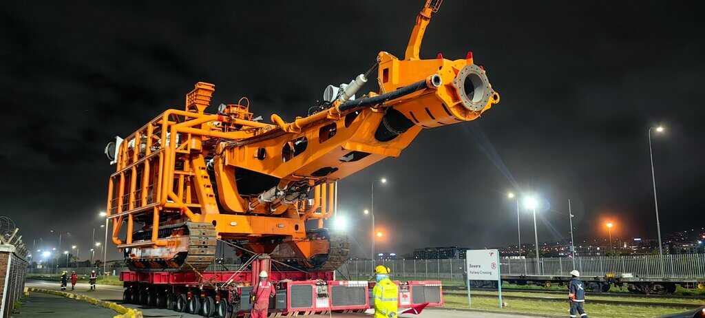 The Next Generation Crawler (NGC) being carefully transported to the MV Benguela Gem at the dry dock for integration.