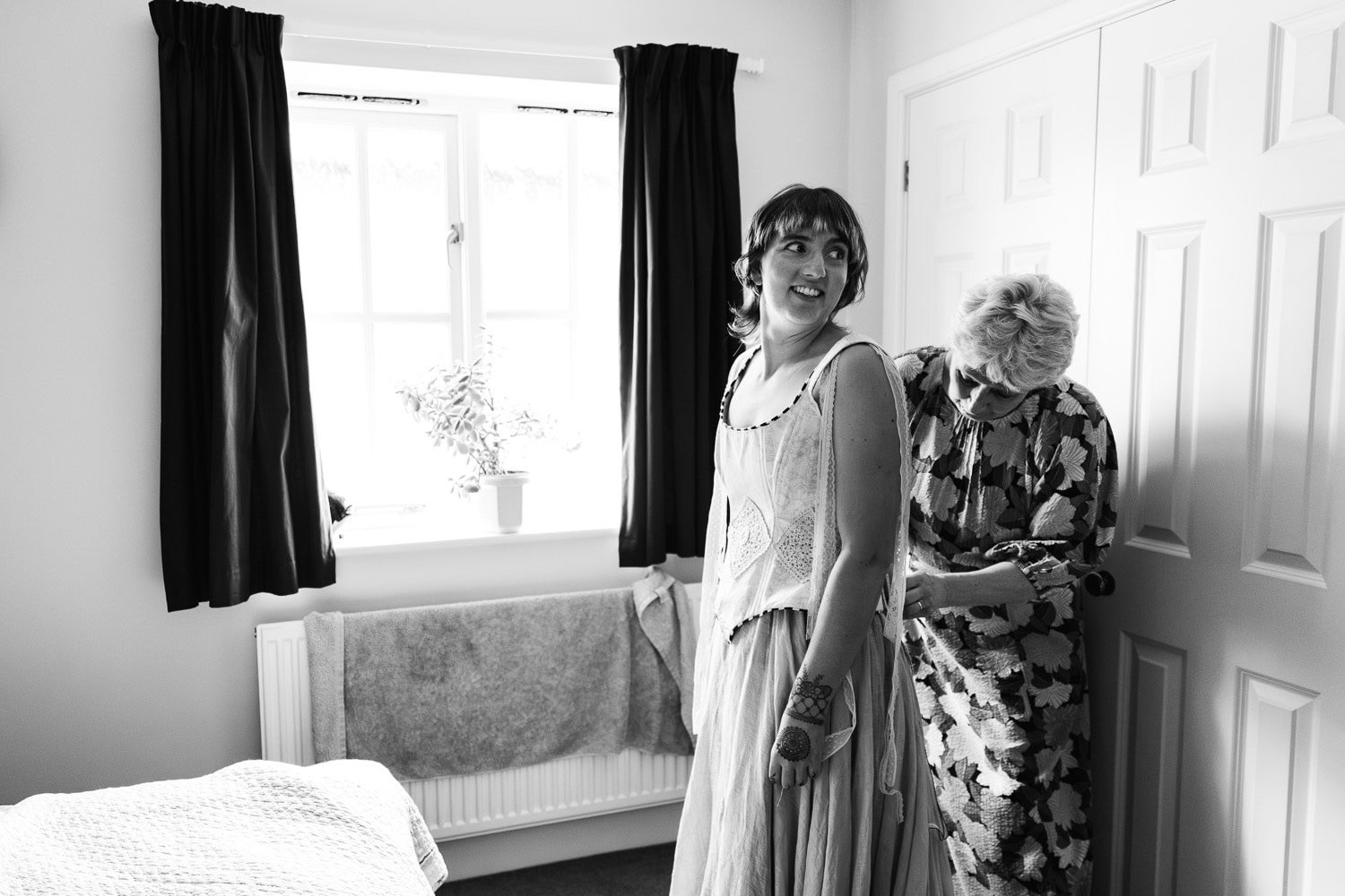 Photography of a yellow DIY wedding in a barn by London photographer Lauren Squire