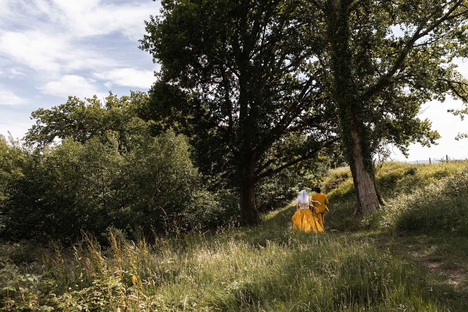 Photography of a yellow DIY wedding in a barn by London photographer Lauren Squire
