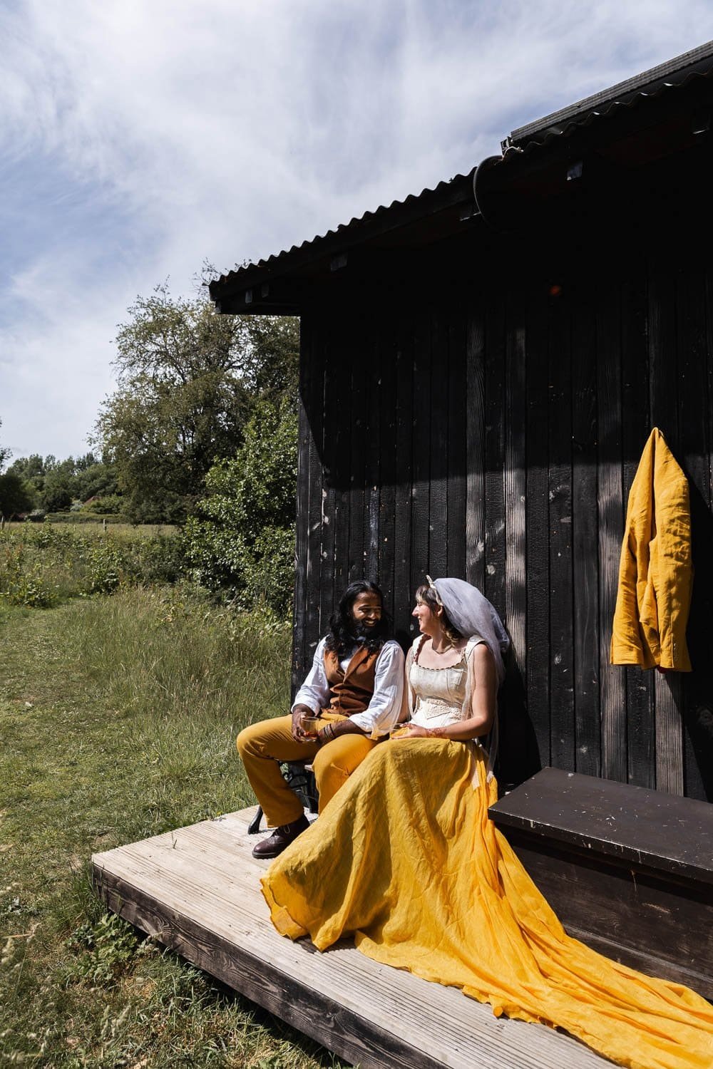 Photography of a yellow DIY wedding in a barn by London photographer Lauren Squire