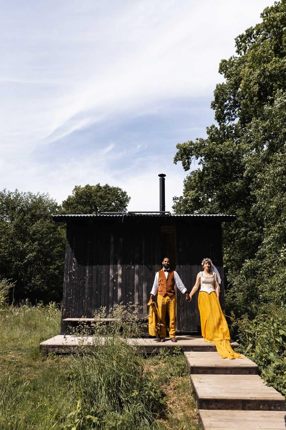 Photography of a yellow DIY wedding in a barn by London photographer Lauren Squire