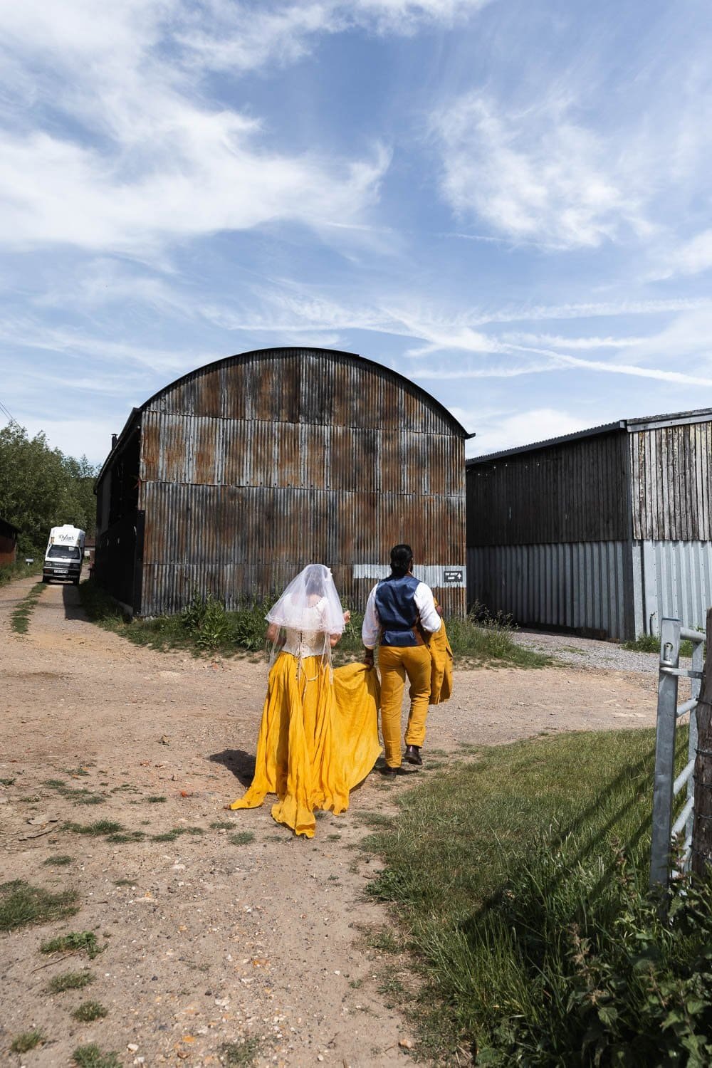 Photography of a yellow DIY wedding in a barn by London photographer Lauren Squire