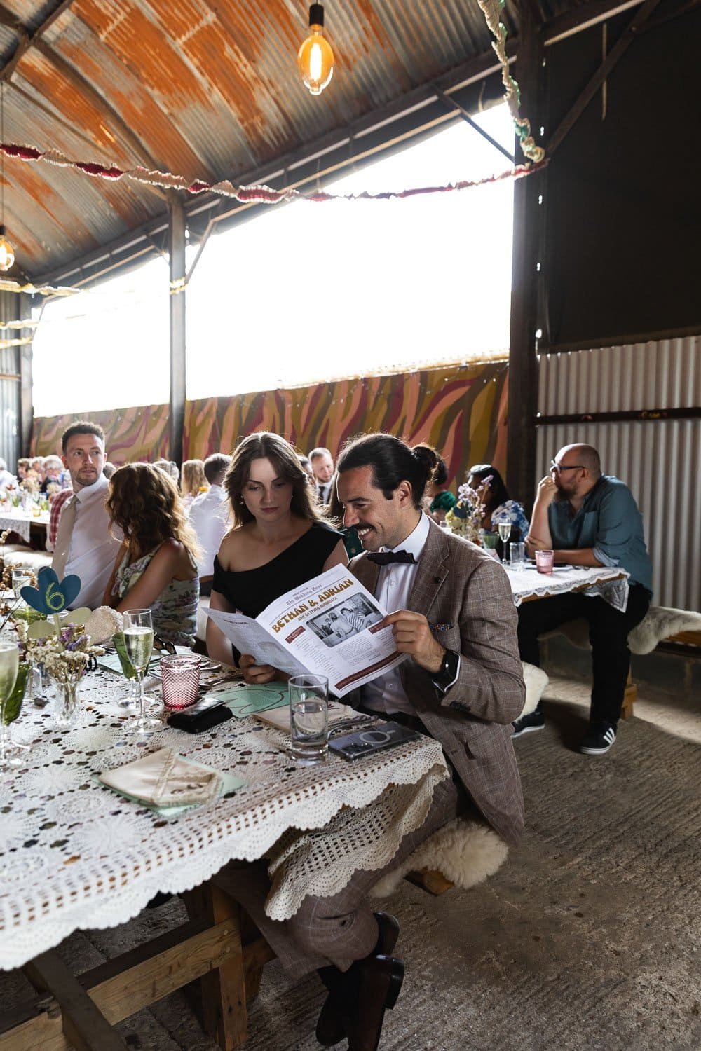 Photography of a yellow DIY wedding in a barn by London photographer Lauren Squire