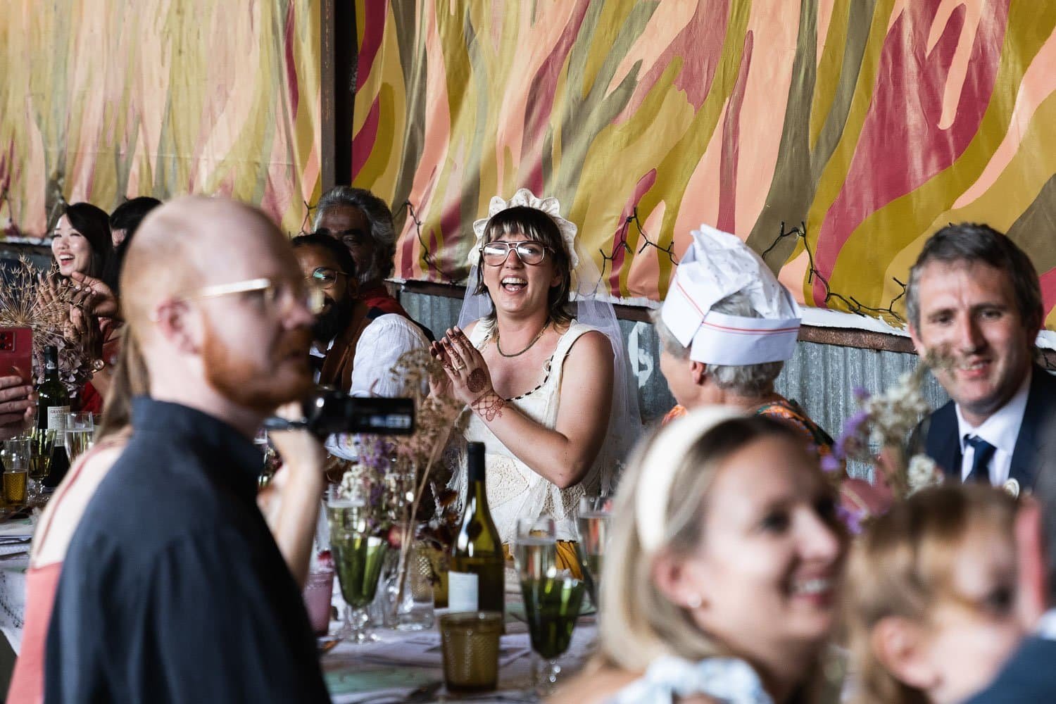 Photography of a yellow DIY wedding in a barn by London photographer Lauren Squire