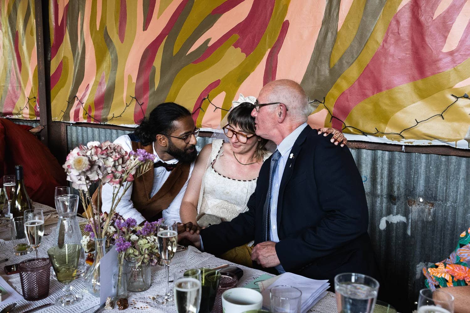 Photography of a yellow DIY wedding in a barn by London photographer Lauren Squire