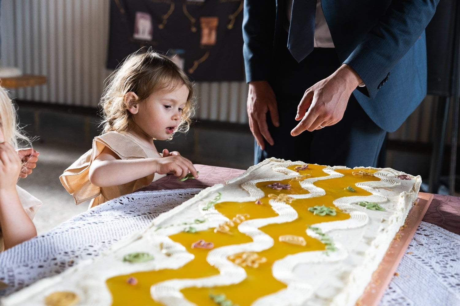 Photography of a yellow DIY wedding in a barn by London photographer Lauren Squire