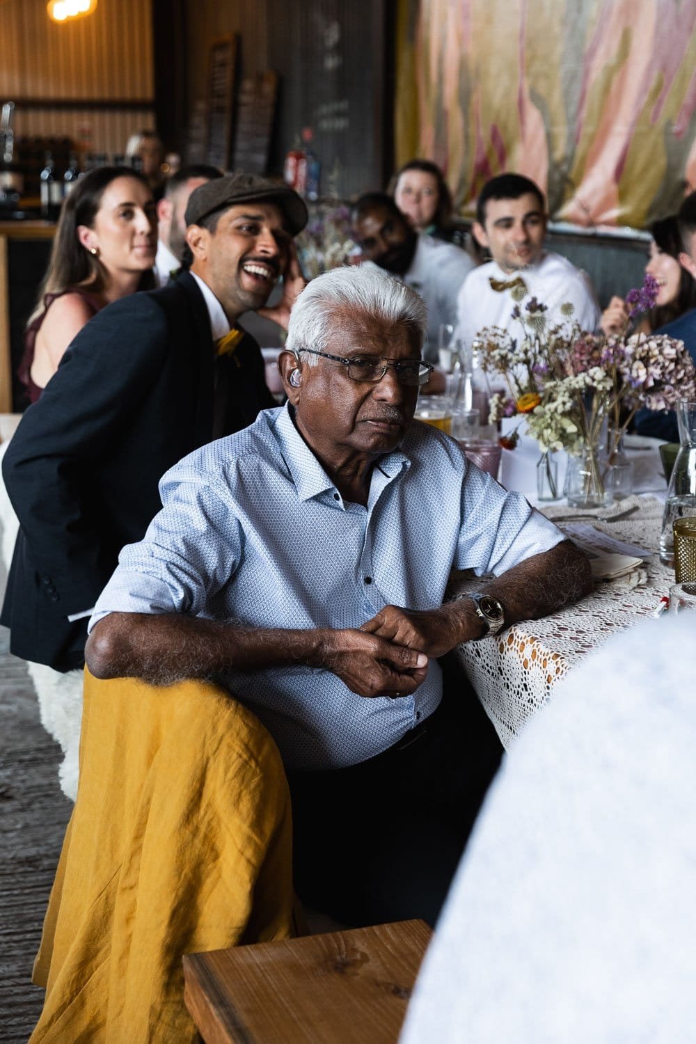 Photography of a yellow DIY wedding in a barn by London photographer Lauren Squire