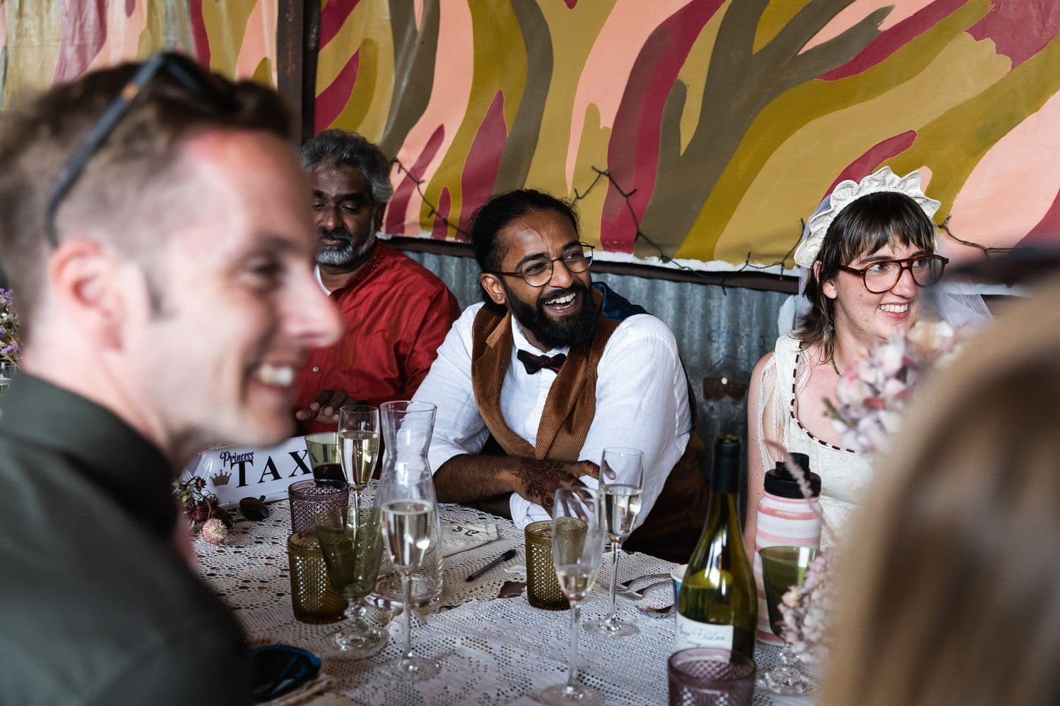 Photography of a yellow DIY wedding in a barn by London photographer Lauren Squire