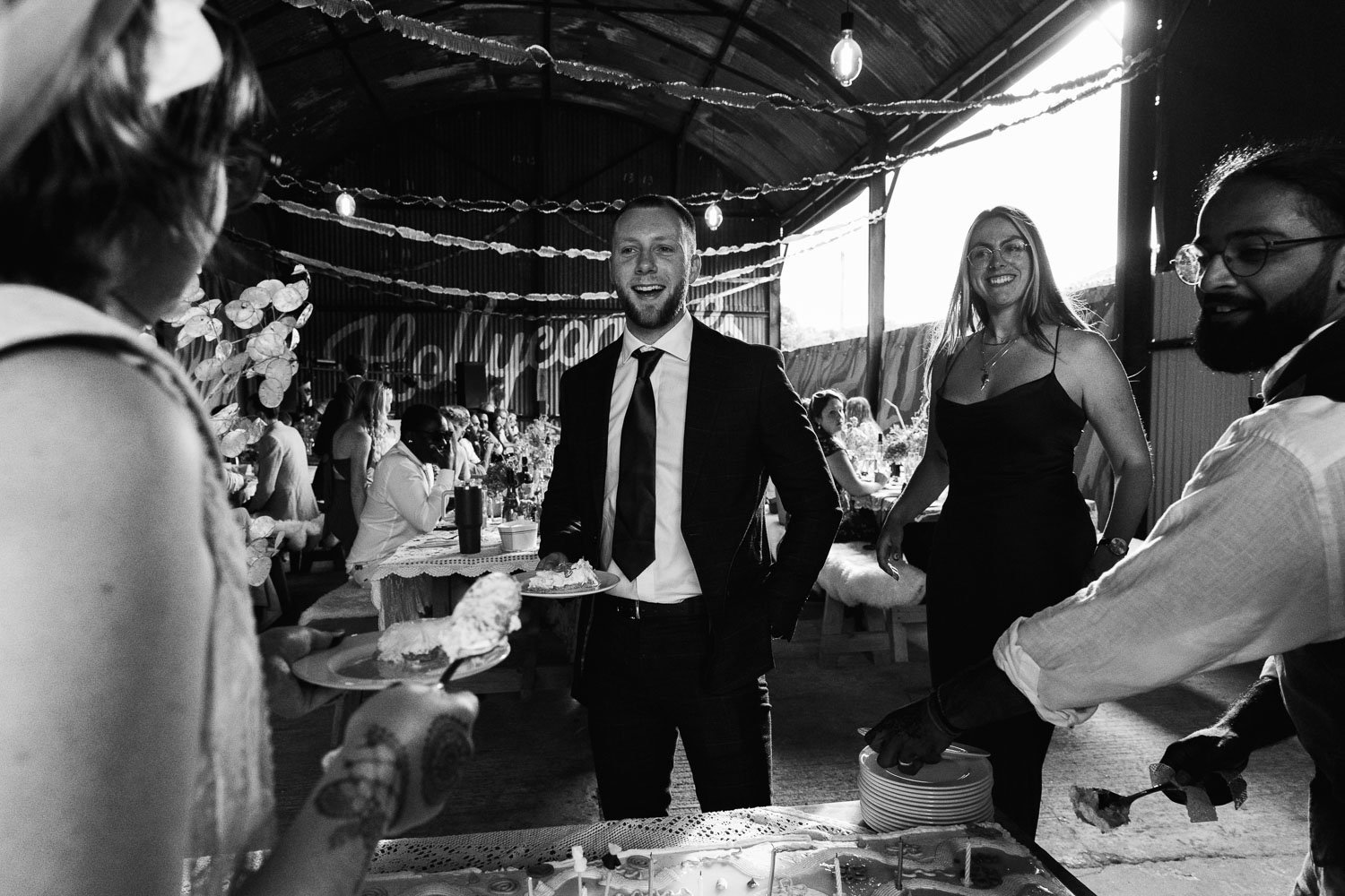 Photography of a yellow DIY wedding in a barn by London photographer Lauren Squire