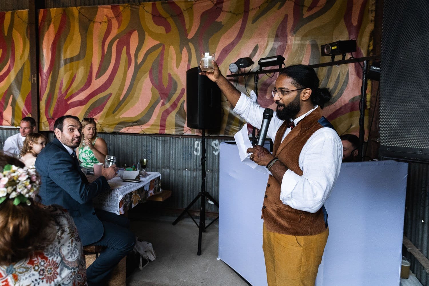 Photography of a yellow DIY wedding in a barn by London photographer Lauren Squire