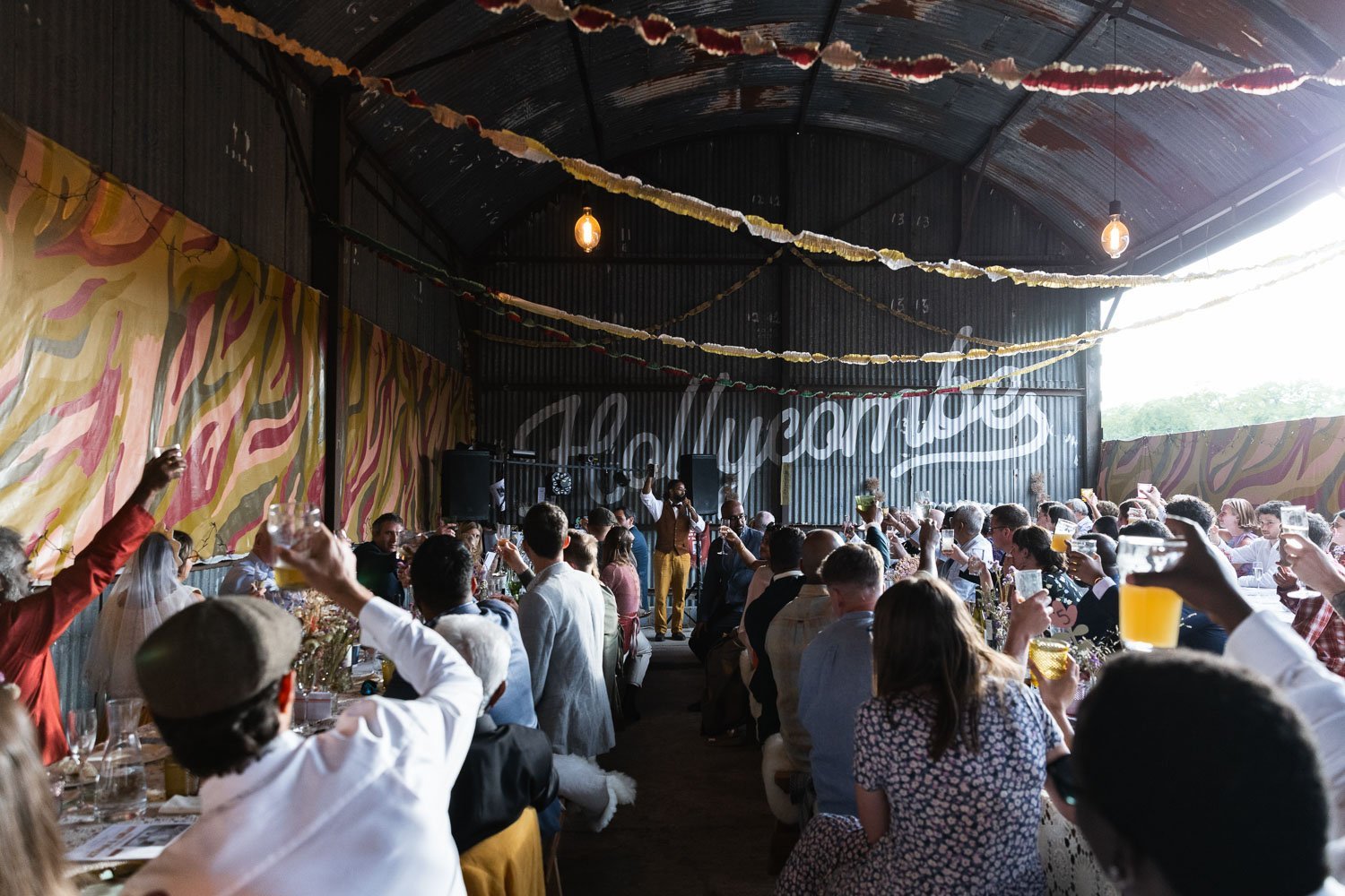 Photography of a yellow DIY wedding in a barn by London photographer Lauren Squire