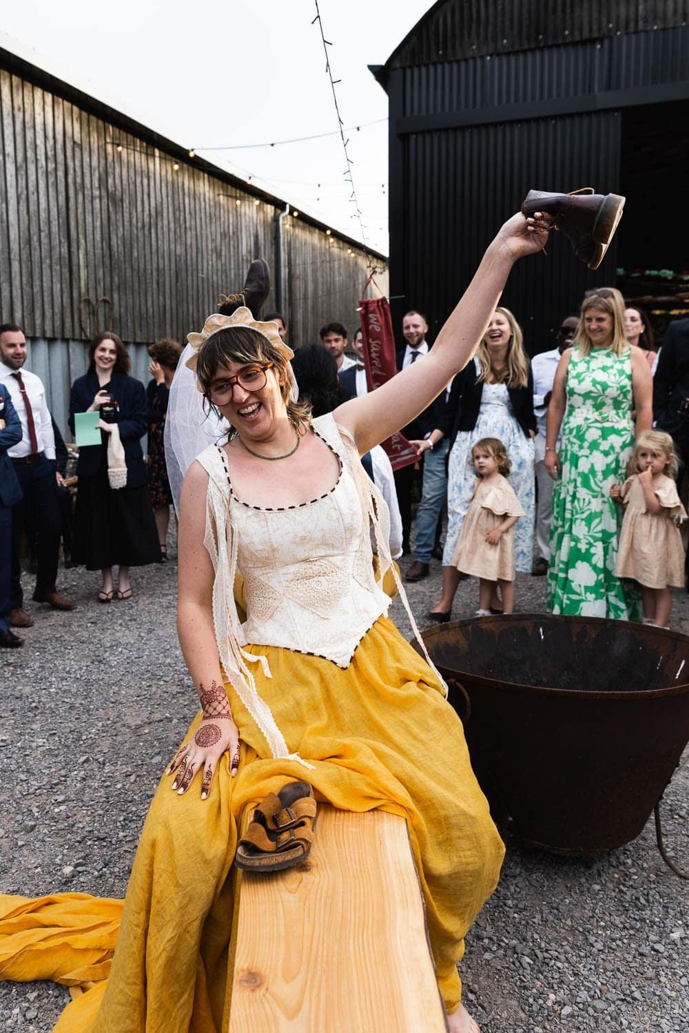 Photography of a yellow DIY wedding in a barn by London photographer Lauren Squire