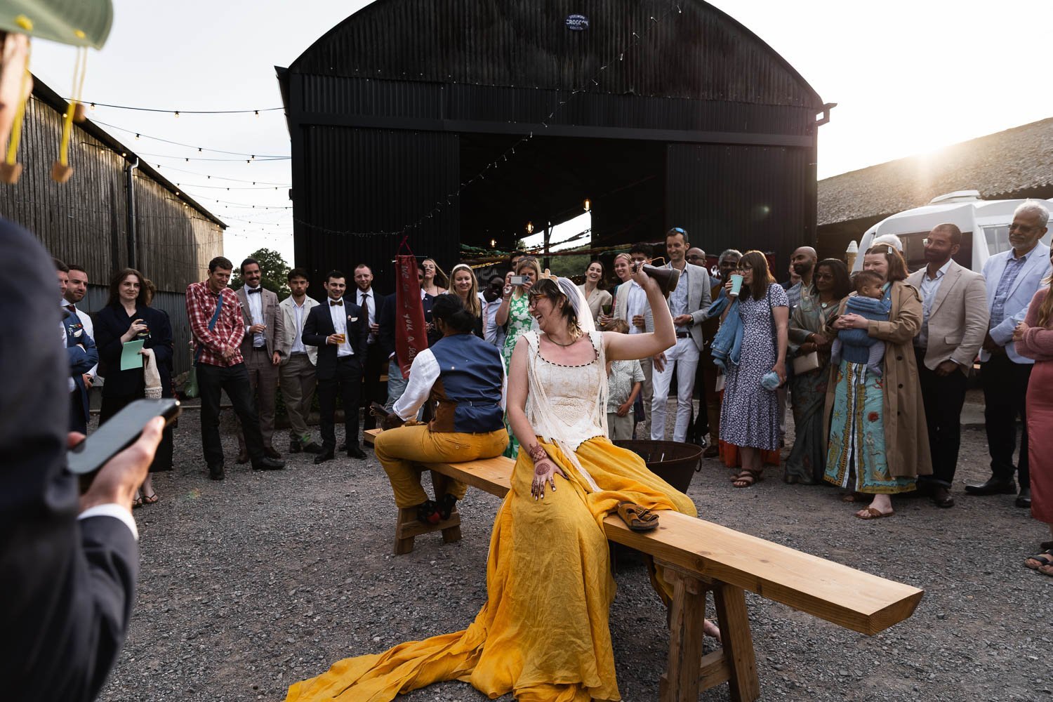 Photography of a yellow DIY wedding in a barn by London photographer Lauren Squire
