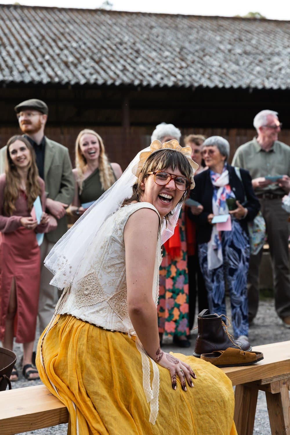 Photography of a yellow DIY wedding in a barn by London photographer Lauren Squire