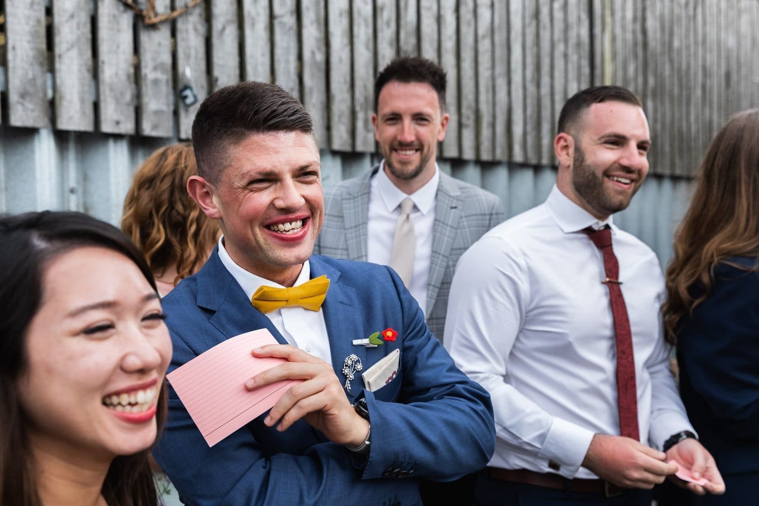 Photography of a yellow DIY wedding in a barn by London photographer Lauren Squire
