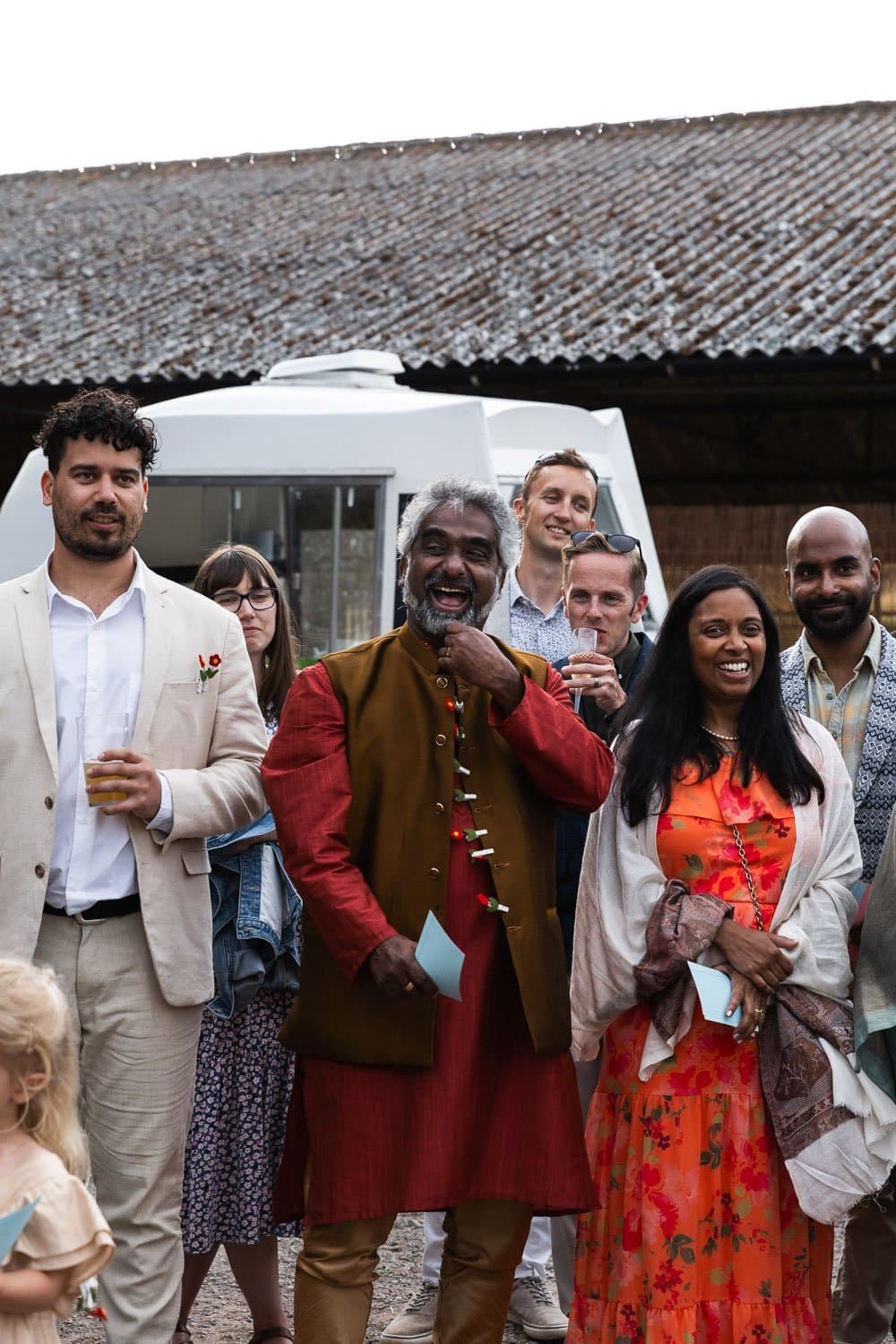 Photography of a yellow DIY wedding in a barn by London photographer Lauren Squire