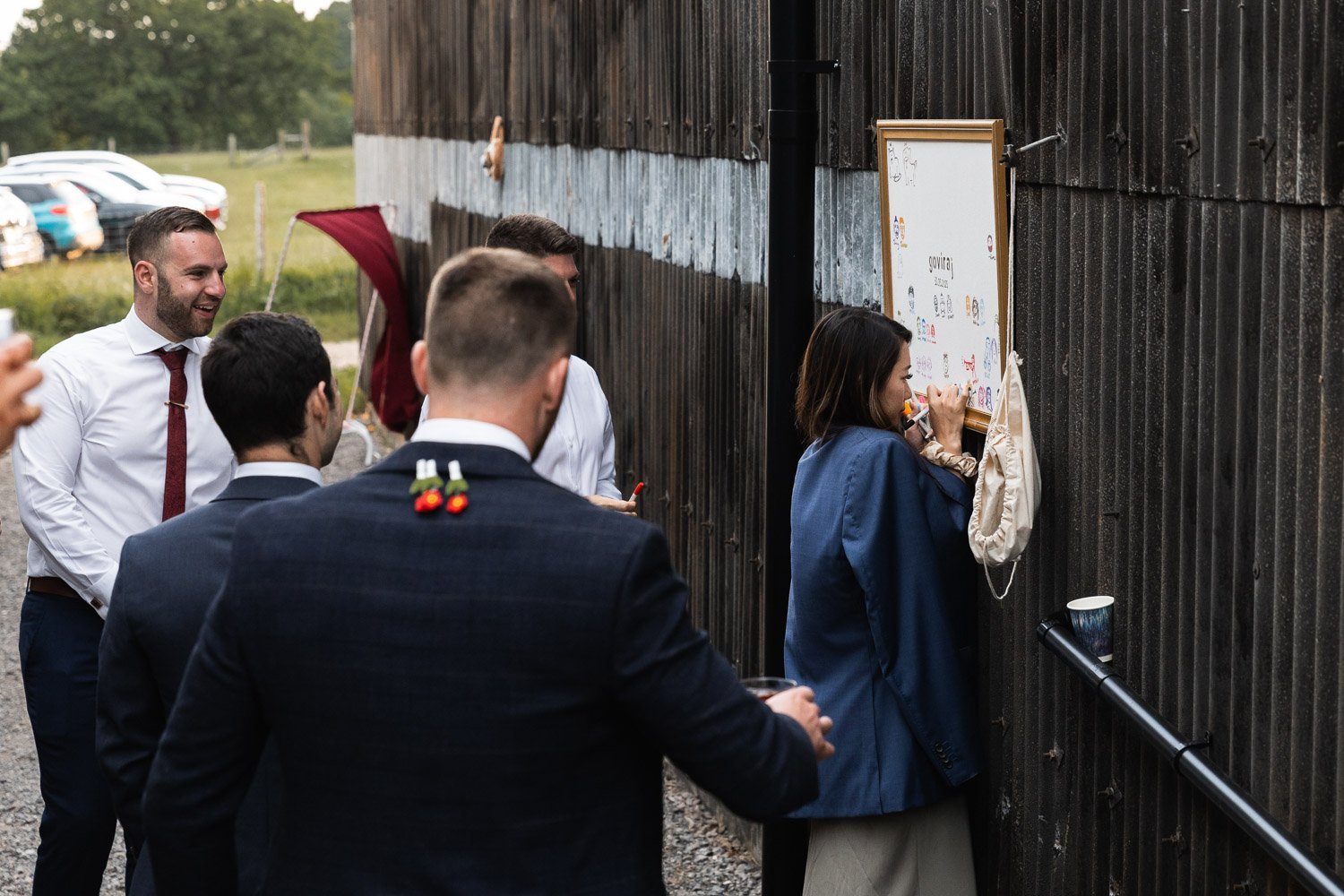Photography of a yellow DIY wedding in a barn by London photographer Lauren Squire