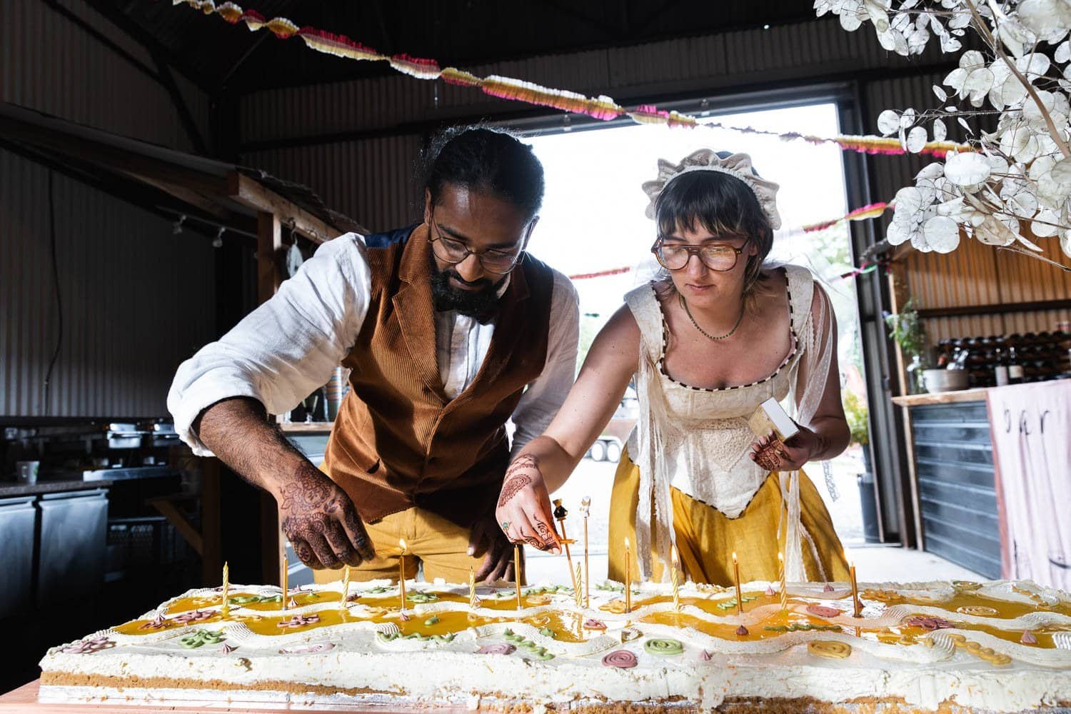 Photography of a yellow DIY wedding in a barn by London photographer Lauren Squire