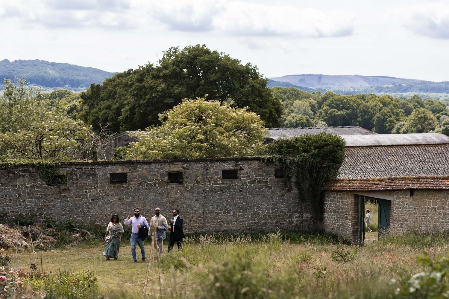 Photography of a yellow DIY wedding in a barn by London photographer Lauren Squire