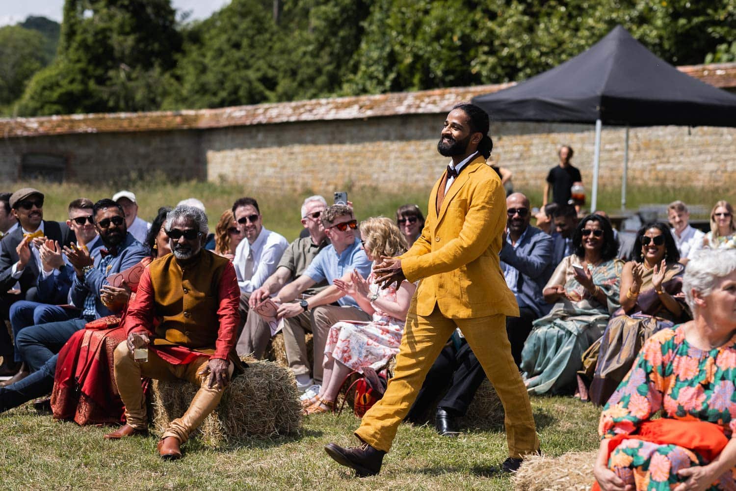 Photography of a yellow DIY wedding in a barn by London photographer Lauren Squire