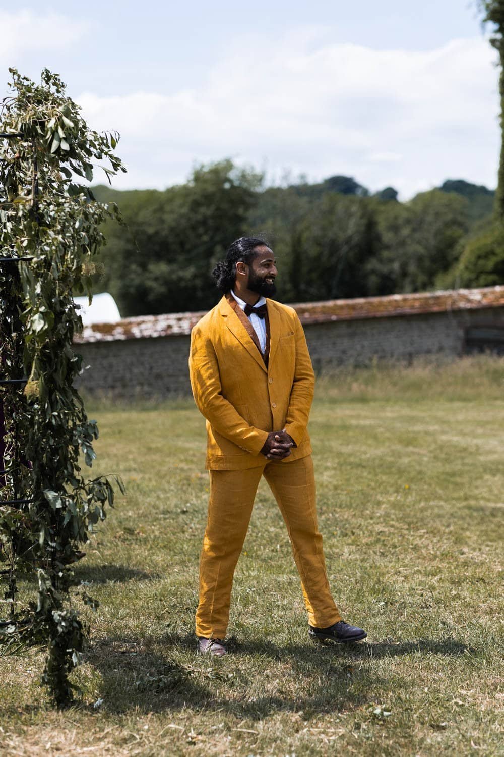 Photography of a yellow DIY wedding in a barn by London photographer Lauren Squire