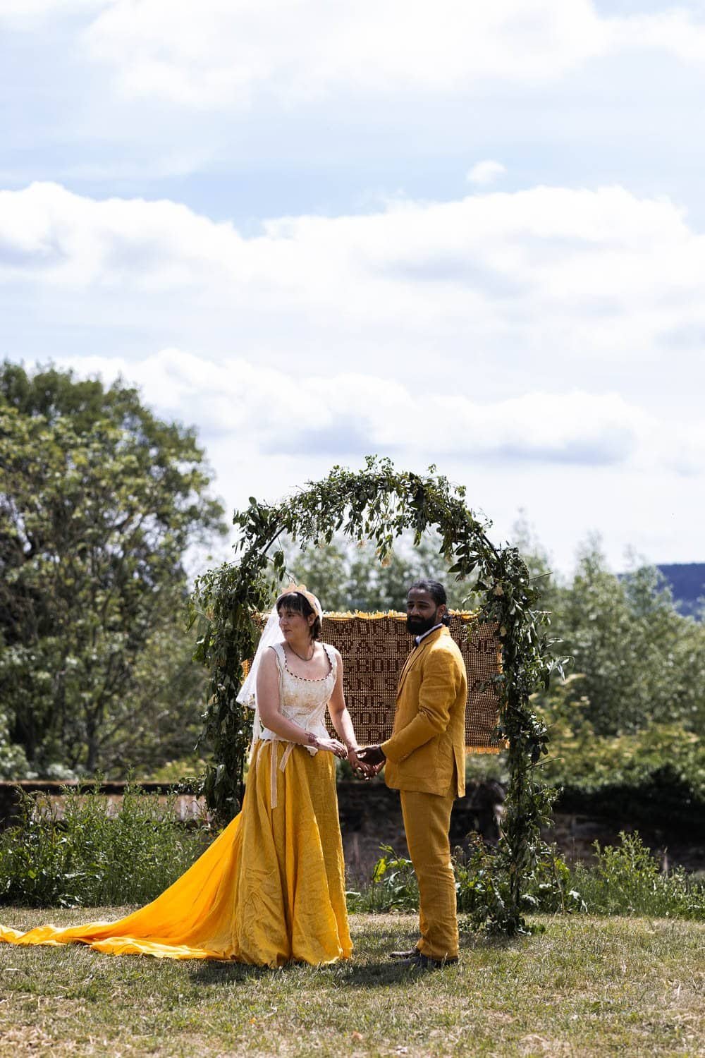 Photography of a yellow DIY wedding in a barn by London photographer Lauren Squire
