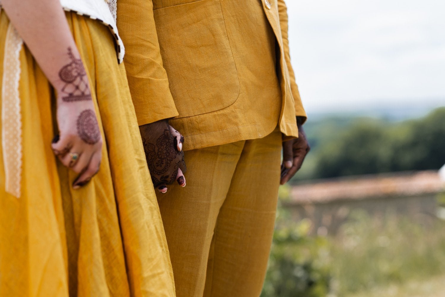 Photography of a yellow DIY wedding in a barn by London photographer Lauren Squire