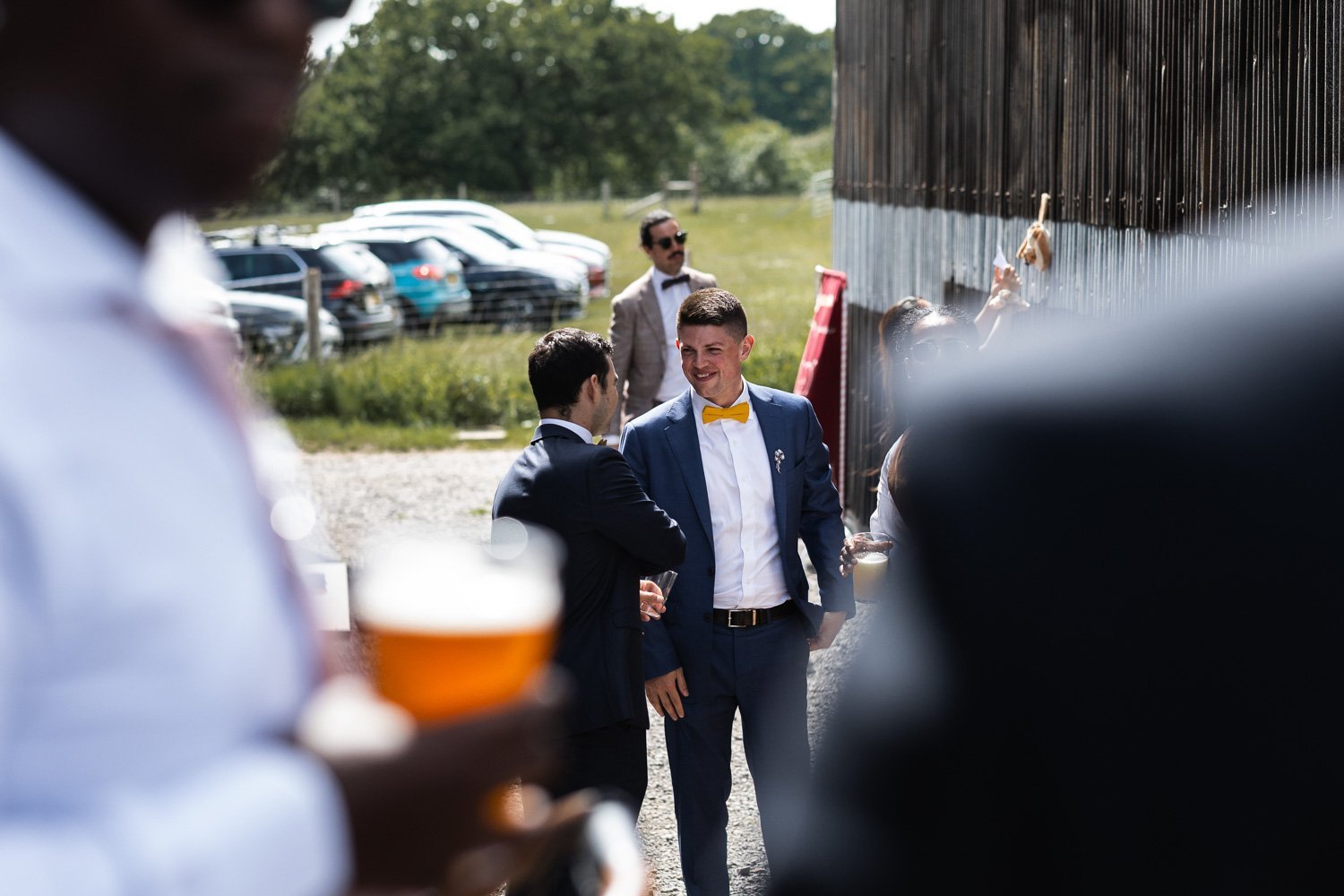 Photography of a yellow DIY wedding in a barn by London photographer Lauren Squire