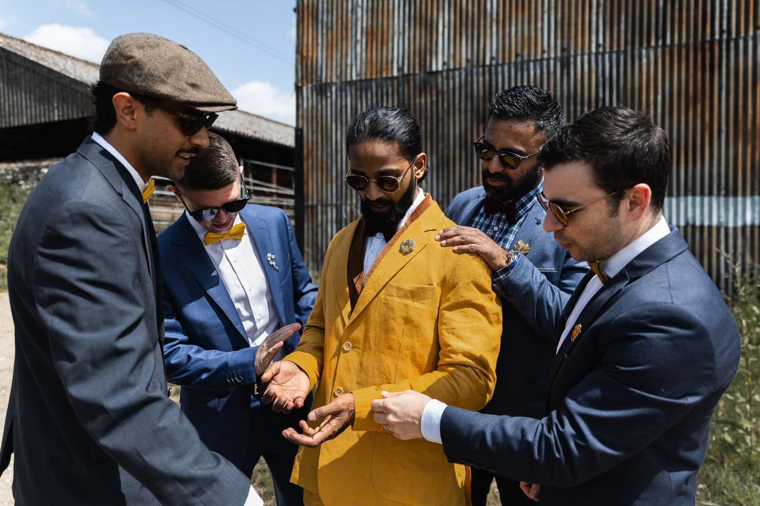 Photography of a yellow DIY wedding in a barn by London photographer Lauren Squire