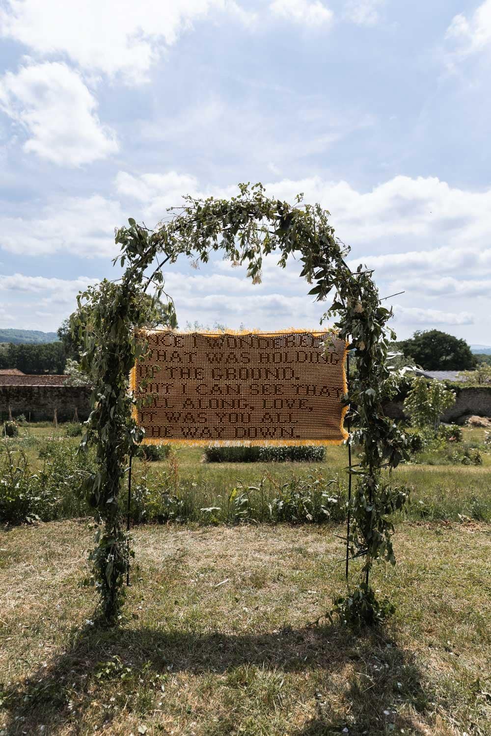 Photography of a yellow DIY wedding in a barn by London photographer Lauren Squire